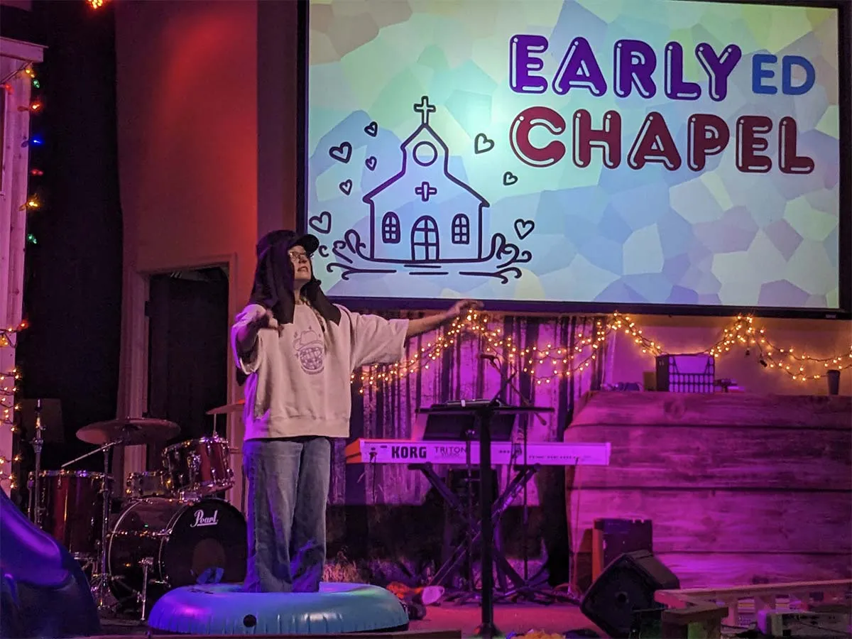 early-education-chapel-worship-service Early education students in chapel during worship service with colorful window